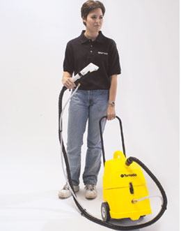 Tornado PS Spotter Extractor (55 PSI, 2-Gallon, with Hose & Hand Tool) – Model 98220 man holding the hand tool and pushing unit