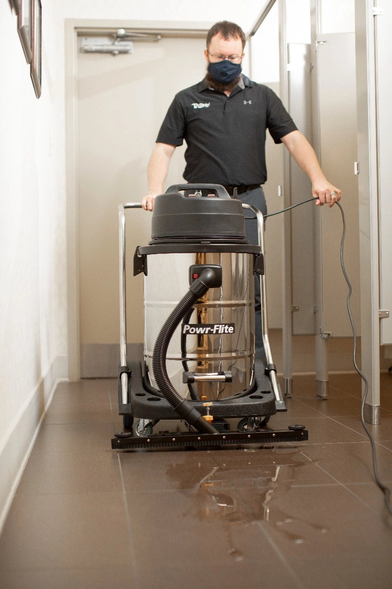 Powr-Flite Wet Dry Vacuum 20 Gallon Dual Motor with Stainless Steel Tank PF57 sucking up water with vacuum squeegee