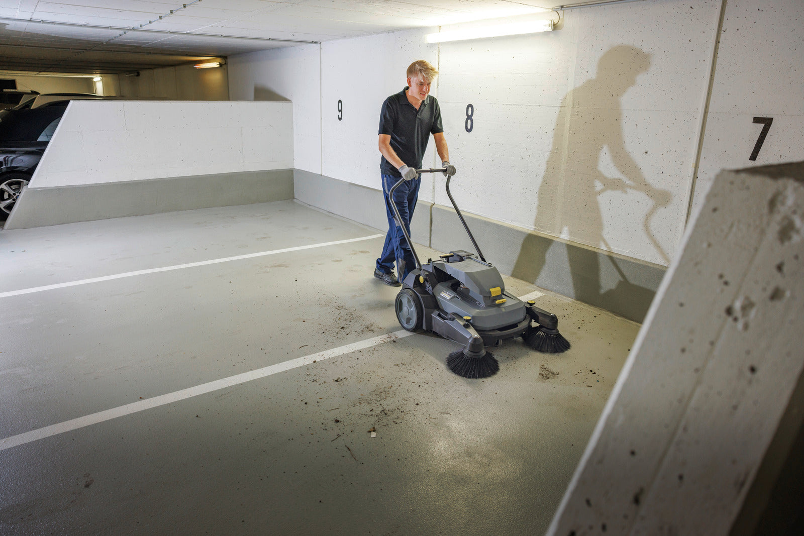 Karcher Sweeper KM 70/30 C BP PACK 2SB *KNA Commercial Walk-Behind Vacuum Sweeper parkade sweeping in use