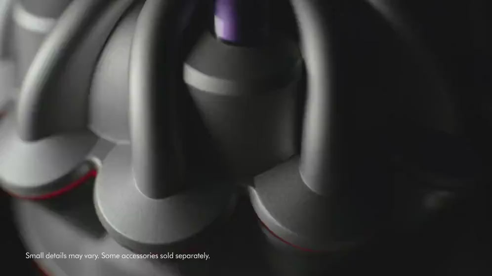 Dyson V8 Origin vacuuming dirt, debris and hair off floor. Displaying cyclonic technology.