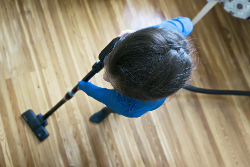 little kid vacuuming