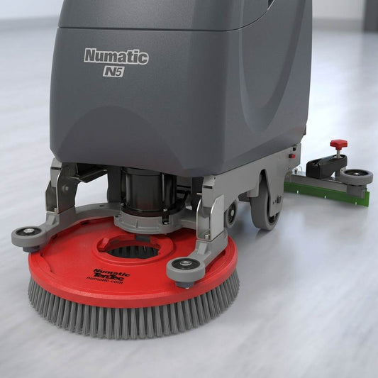 Numatic floor scrubber machine equipped with dark grey heavy-duty Ten-Tec high-performance scrub brush bristles, featured on a clean white background with a close-up inset.