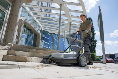 Karcher KM 70/20 C Manual Sweeper sweeping out door and leaves