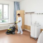 woman using Karcher BD 38/12 to clean hospital
